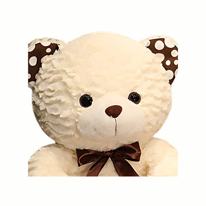 Close-up of the cute face of the Plush Classic Teddy Bear in white, highlighting its gentle, nurturing expression