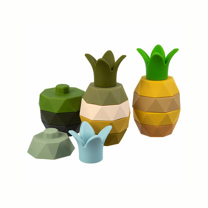 Silicone Pineapple Stacking Toy sets in blue, green, and olive, showing the colorful pineapple slices stacked and partly stacked, a wobbly tower that is BPA-free and made from food-grade silicone.