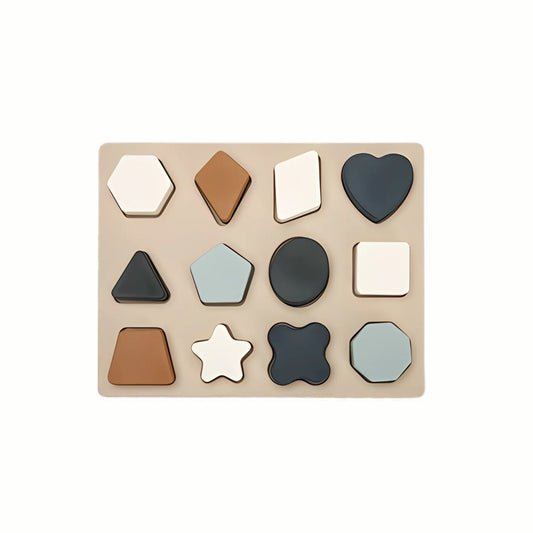 Silicone Shapes Puzzle in the blue color set, showing the full puzzle pieces nested into the wooden base, a food-grade silicone tactile toy.