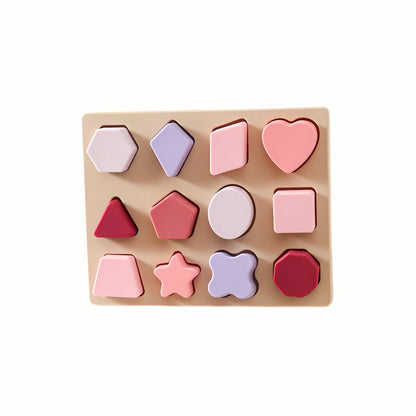 Silicone Shapes Puzzle in the pink color set, showing all the shapes neatly placed in the wooden base, designed to be safe for toddlers.