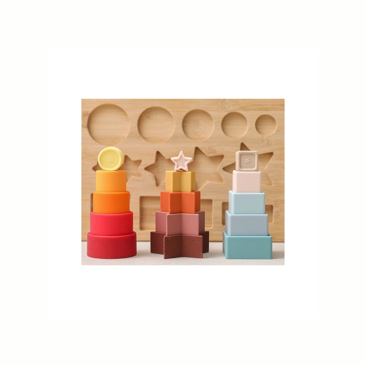 Silicone Shapes Stacking Puzzle, showing the soft silicone pieces stacked in front of the wooden base, a food-grade silicone and sustainably sourced toy.