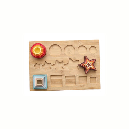 Silicone Shapes Stacking Puzzle with all the shapes correctly nested and stacked onto the wooden base pegs, developing fine motor skills and hand-eye coordination.