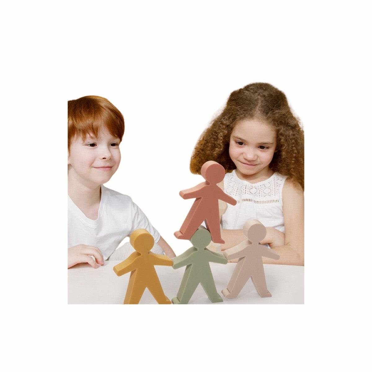 children playing with the silicone stacking figures.