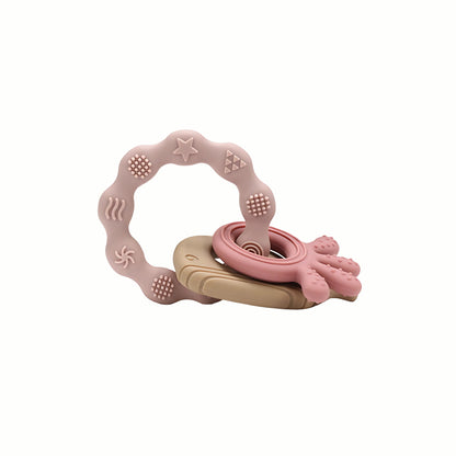 Full view of the pink Silicone Teething Keyring, a safe for teething baby accessory that is lightweight and easy to clean.