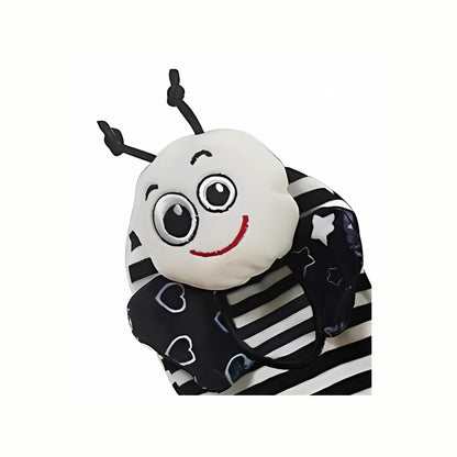 Close-up of the charming bee face on the Soft Black & White Rattle Sock, highlighting the gentle rattles inside that encourage early sensory exploration.