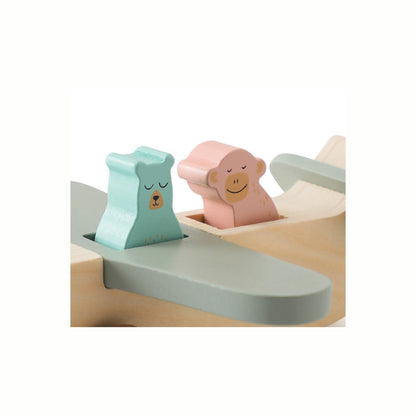 A close-up of the two charming wooden animal figures sitting inside the Wooden Animal Plane, highlighting the detail of the passengers.