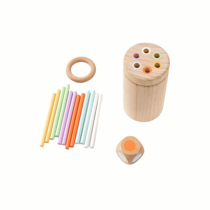 The complete Wooden Balance and Posting Sticks Game set, featuring the wooden container, the stacking ring, the color die, and all the colorful wooden sticks neatly laid out.
