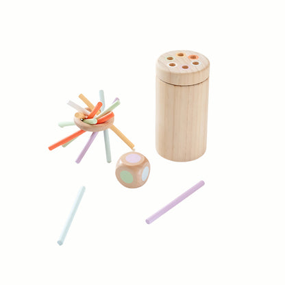 Wooden Balance and Posting Sticks Game, showing the wooden ring with sticks stacked on top, the colored posting container, and the die, a high-quality toy.