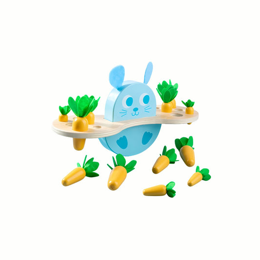 Wooden Bunny & Carrot Balancing Game, showing the rocking bunny base with some carrots balanced and others scattered, a high-quality toy.