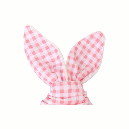 Close-up of the pink and white gingham fabric on the Wooden Bunny Teething Ring, demonstrating the easy grip and soft texture for little hands.
