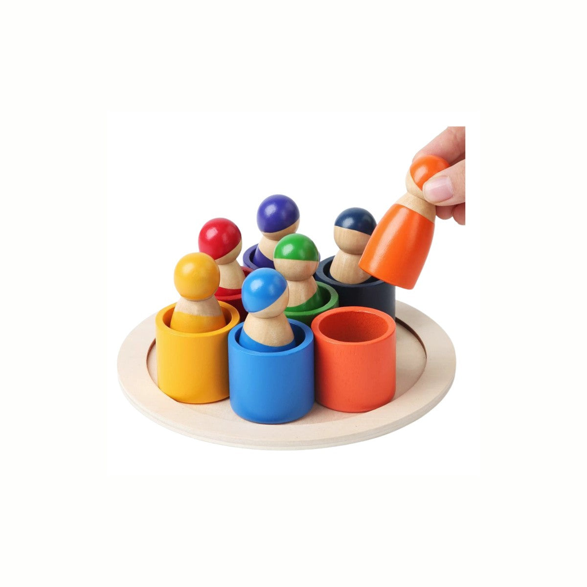 A hand inserting a figure into its corresponding colored cylinder on the Wooden Color Matching Game, developing color recognition and fine motor skills.