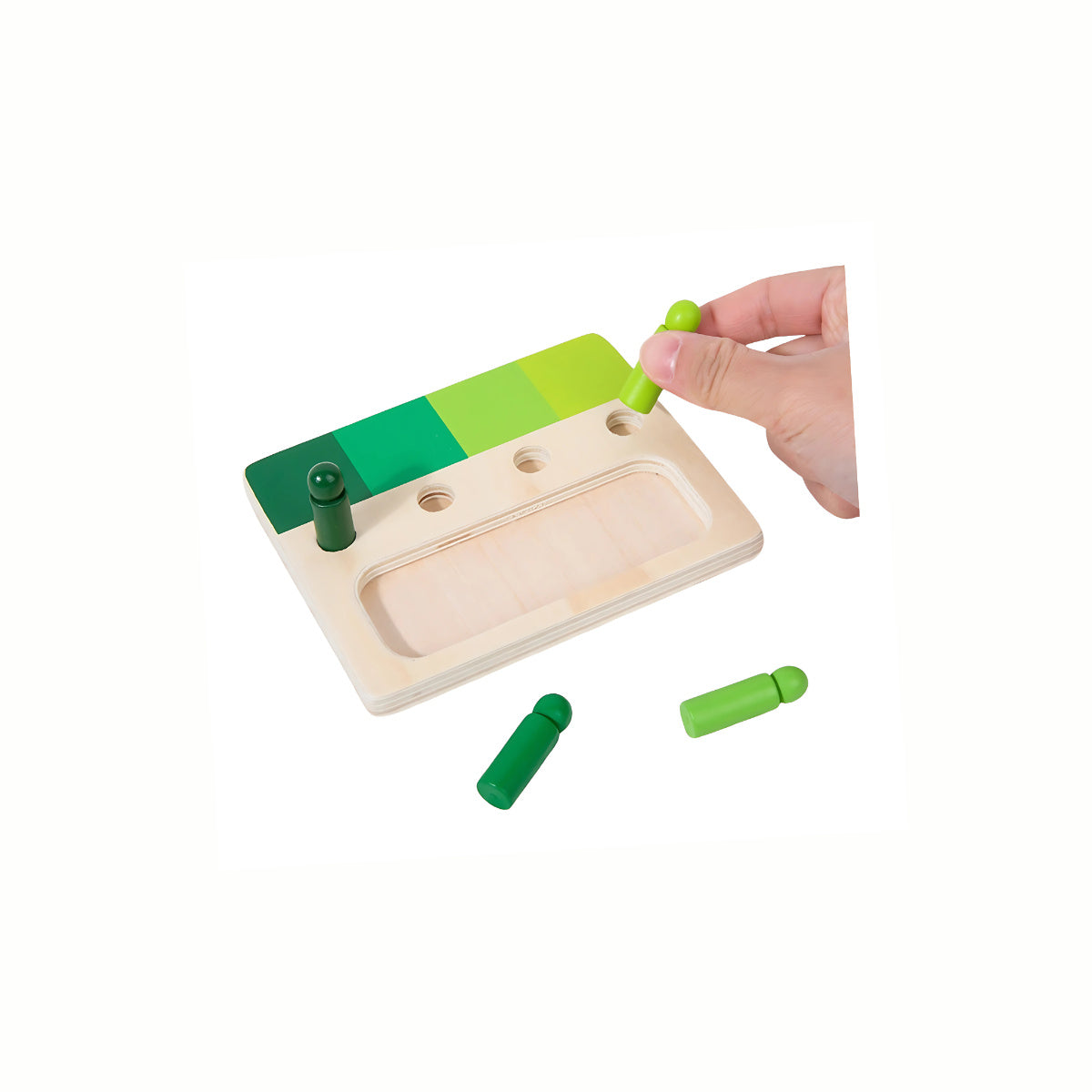 A hand inserting a colored peg into the correct hole on the Wooden Color Shade Matching Toy, developing visual discrimination and fine motor skills.
