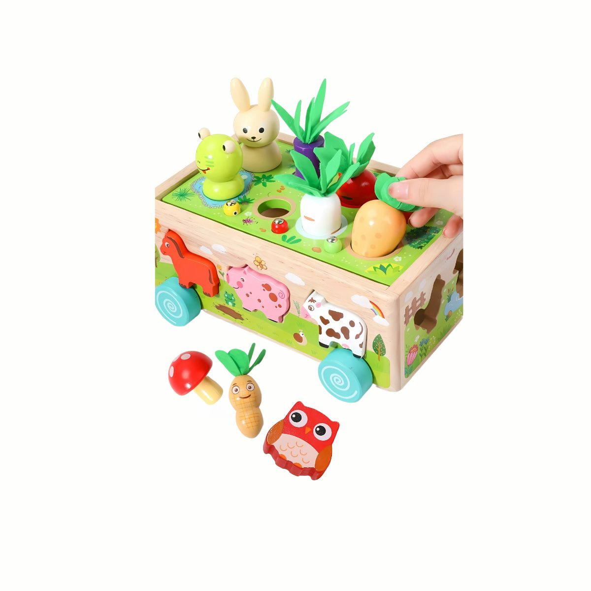 A hand pulling the wooden carrot from the top of the Wooden Farm Shape Sorter Car, illustrating the push-and-pull action for fine motor skills.