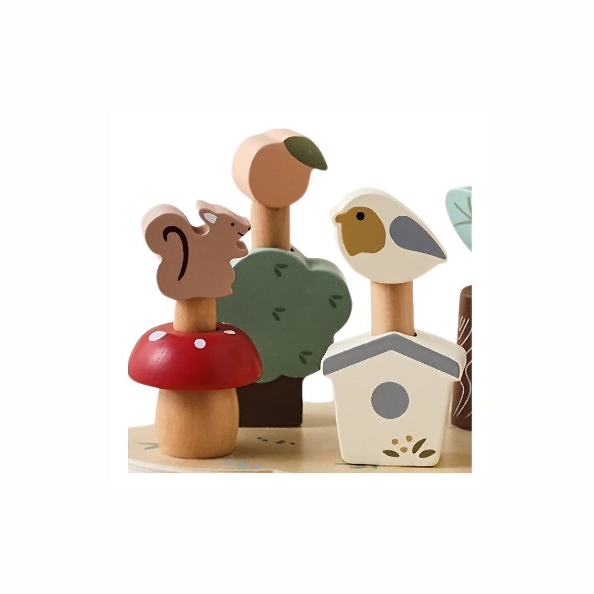 Wooden Pop Out Woodland Playset, a close-up on the wooden base showing the pop-out slots and several animal figures waiting to be placed, designed to develop fine motor skills and appreciation for nature.