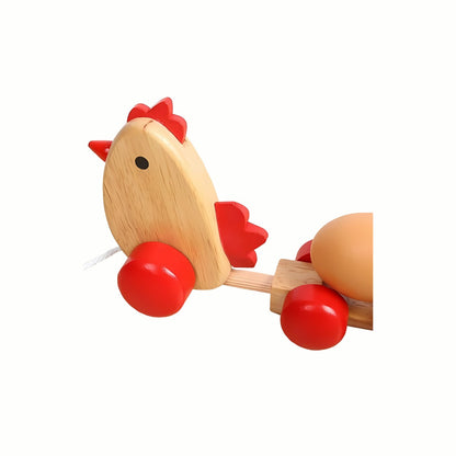 A close-up of the friendly chicken engine head on the Wooden Pull Along Chicken Train, highlighting the smooth wood.