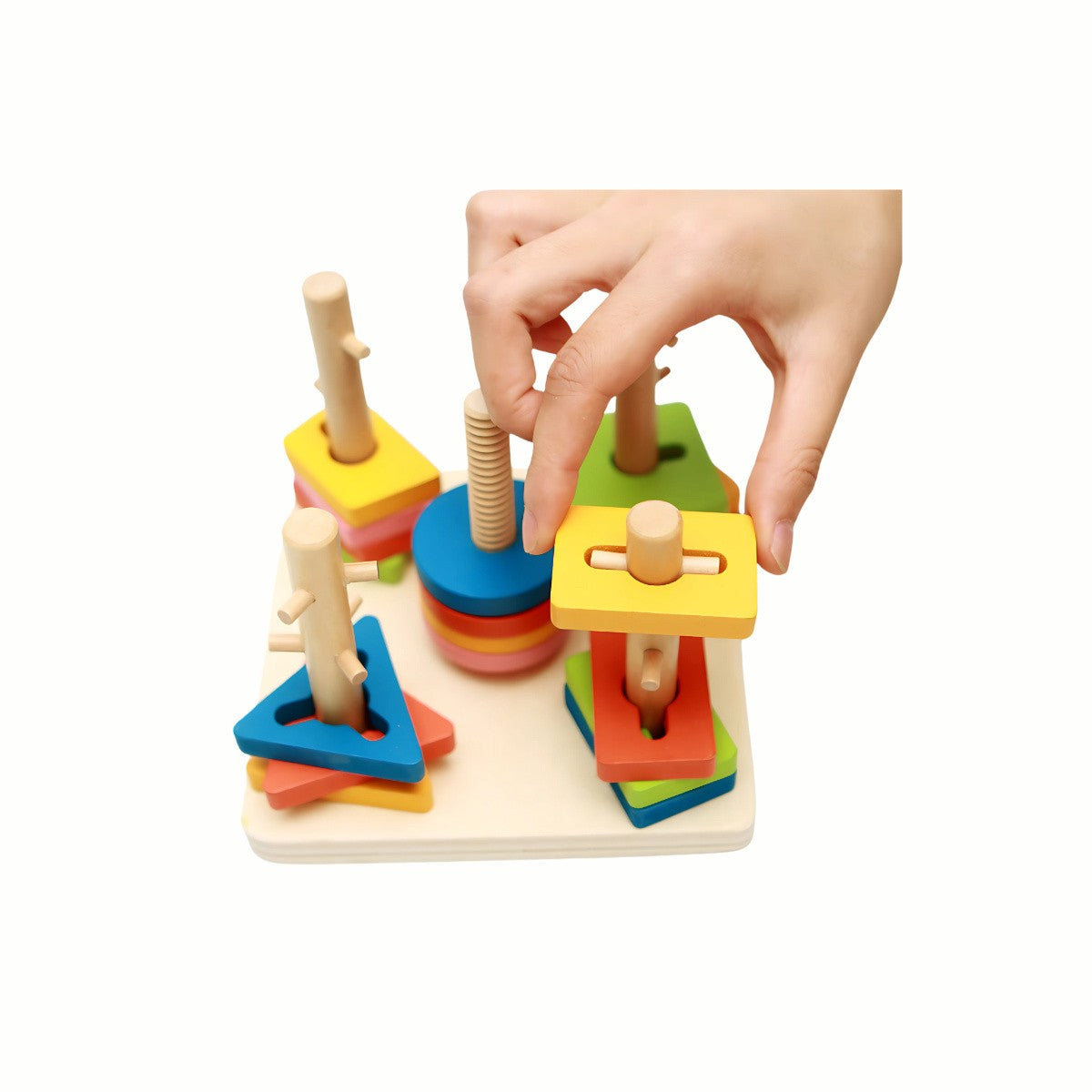 A child's hand carefully inserting a wooden shape onto a corresponding peg on the Wooden Shape Sorting and Stacking Puzzle, developing fine motor skills and spatial awareness.